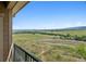 Expansive balcony view overlooking lush greenery and distant scenery, offering tranquility and serenity at 10062 W Victoria Pl # 205, Littleton, CO 80127