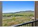 Stunning balcony view showcasing rolling hills and clear blue skies provides a sense of natural beauty at 10062 W Victoria Pl # 205, Littleton, CO 80127