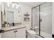Modern bathroom with a glass-enclosed shower, sleek vanity, and neutral color palette at 10062 W Victoria Pl # 205, Littleton, CO 80127