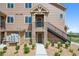 Apartment exterior showing private balcony and outdoor entry at 10062 W Victoria Pl # 205, Littleton, CO 80127