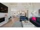 Open living space with a kitchen view, perfect for entertaining, featuring modern decor and comfortable furnishings at 10062 W Victoria Pl # 205, Littleton, CO 80127