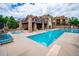 Inviting pool area with multiple pools, lounge chairs, and well-maintained surrounding landscaping at 10062 W Victoria Pl # 205, Littleton, CO 80127