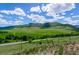 Scenic view of green hills and open fields, providing a sense of tranquility and natural beauty at 10062 W Victoria Pl # 205, Littleton, CO 80127