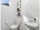 Clean and modern powder room with pedestal sink at 3989 Gold Bug St, Aurora, CO 80019