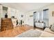 Bright living room with hardwood floors, natural light, and staircase at 2723 E 96Th Way, Thornton, CO 80229