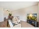 Cozy living room featuring modern furniture and a dining area at 10211 Ura Ln # 3-104, Thornton, CO 80260