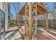 Relax in this backyard gazebo with wood beams and built-in seating, perfect for outdoor entertaining at 7672 E Arizona Dr, Denver, CO 80231