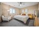 Relaxing bedroom with king-size bed and ceiling fan at 24758 E Arizona Cir, Aurora, CO 80018