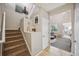 Bright entryway with staircase and view to living room at 24758 E Arizona Cir, Aurora, CO 80018