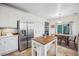 Modern kitchen featuring stainless steel appliances and an island at 24758 E Arizona Cir, Aurora, CO 80018