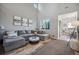 Spacious living room featuring a comfortable sectional sofa at 24758 E Arizona Cir, Aurora, CO 80018