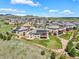 An expansive view shows many houses with mountain views at 9510 Orion Way, Arvada, CO 80007