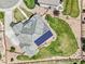 Aerial view of a home with solar panels, a deck, and a lush lawn at 9510 Orion Way, Arvada, CO 80007