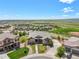Aerial view of a home with a well-kept lawn and landscaping nestled in a scenic, suburban neighborhood at 9510 Orion Way, Arvada, CO 80007