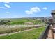 Scenic view from the deck overlooking a well-maintained yard and community baseball field at 9510 Orion Way, Arvada, CO 80007