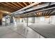 Expansive basement with open ceiling, concrete floors, partially finished walls and some carpeting at 9510 Orion Way, Arvada, CO 80007