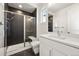 Modern bathroom featuring a vanity with shower and a large mirror at 9510 Orion Way, Arvada, CO 80007