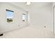 Neutral bedroom featuring carpet and a dual window with neighborhood views at 9510 Orion Way, Arvada, CO 80007