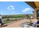 Deck with comfortable seating and a stunning view of the lush green landscape at 9510 Orion Way, Arvada, CO 80007