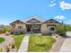 Inviting single story home with stone accents, manicured lawn, and well-maintained landscaping at 9510 Orion Way, Arvada, CO 80007