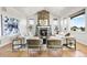 Stylish living room with stone fireplace, vaulted ceilings, hardwood floors, and lots of natural light at 9510 Orion Way, Arvada, CO 80007