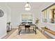 Well-lit office with a modern desk, cowhide rug, and a window with backyard views at 9510 Orion Way, Arvada, CO 80007