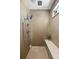Modern shower features a seat, dual shower heads and neutral tiling at 9510 Orion Way, Arvada, CO 80007