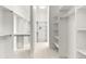 Bright walk-in closet featuring shelving and carpet at 9510 Orion Way, Arvada, CO 80007