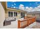 Back patio with cozy seating area, perfect for outdoor relaxation and entertainment at 12636 Sandstone Dr, Broomfield, CO 80021