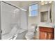 Clean bathroom featuring a shower/tub combo and vanity with dark wood cabinets at 12636 Sandstone Dr, Broomfield, CO 80021
