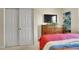 Cozy bedroom with closet, dresser and TV for watching movies at 12636 Sandstone Dr, Broomfield, CO 80021
