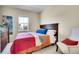 Comfortable bedroom with a dresser and a relaxing sitting chair at 12636 Sandstone Dr, Broomfield, CO 80021