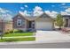 Charming ranch-style home with stone accents, a well-manicured lawn, and a two-car garage at 12636 Sandstone Dr, Broomfield, CO 80021