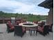 Cozy outdoor firepit surrounded by comfortable seating and a convenient grill area, ideal for entertaining at 12636 Sandstone Dr, Broomfield, CO 80021