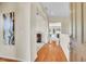Warm and inviting foyer featuring hardwood floors and a view into the living spaces at 12636 Sandstone Dr, Broomfield, CO 80021