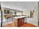 Open concept kitchen with stainless appliances and views of the dining area at 12636 Sandstone Dr, Broomfield, CO 80021