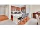Modern kitchen with stainless steel appliances, center island, and breakfast bar at 12636 Sandstone Dr, Broomfield, CO 80021