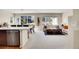 Open-concept living area with a large island, a dining nook, and a comfortable lounge space at 12636 Sandstone Dr, Broomfield, CO 80021