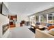 Open living space with fireplace, dining area, and abundant natural light at 12636 Sandstone Dr, Broomfield, CO 80021