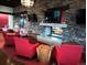 Welcoming lounge area with comfortable armchairs, a cozy fireplace, and stylish decor, perfect for relaxing and socializing at 12636 Sandstone Dr, Broomfield, CO 80021