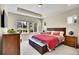 Comfortable bedroom features a trey ceiling, large windows for natural light and stylish furnishings at 12636 Sandstone Dr, Broomfield, CO 80021