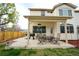 Covered patio with an outdoor dining set, offering a comfortable space for relaxation and entertaining at 17722 E Ida Ave, Centennial, CO 80015
