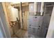 Utility room showcasing a modern water heater and efficient furnace system at 17722 E Ida Ave, Centennial, CO 80015