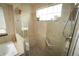 Spa-like bathroom with glass-enclosed shower, pebble floor, and a relaxing soaking tub for ultimate comfort at 17722 E Ida Ave, Centennial, CO 80015