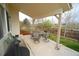 Covered patio area with patio dining set, creating an ideal space for enjoying the outdoors at 17722 E Ida Ave, Centennial, CO 80015