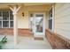 Welcoming entrance showcasing a well-lit porch with a storm door at 17722 E Ida Ave, Centennial, CO 80015