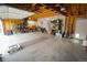 Spacious garage with ample storage, shelving, and workbench area for projects and organization at 17722 E Ida Ave, Centennial, CO 80015
