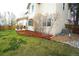 Lush landscaping accents the backyard with barkdust, shrubbery and a well-maintained lawn at 17722 E Ida Ave, Centennial, CO 80015