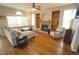Bright living room with hardwood floors, a fireplace, and large windows at 17722 E Ida Ave, Centennial, CO 80015
