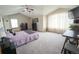 Spacious main bedroom with vaulted ceiling, plush carpet, and natural light, offering a serene retreat at 17722 E Ida Ave, Centennial, CO 80015